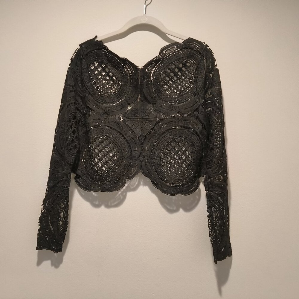 Black crochet crop top,  gold zip at the back No fabric tag No size tag